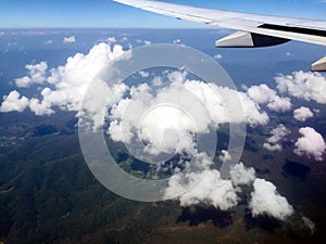 Looking aerial view of Cloud and Green Mountain outside Airplane Window photo