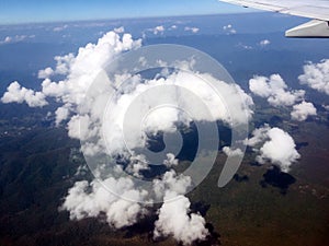 Looking aerial view of Cloud and Green Mountain outside Airplane Window photo