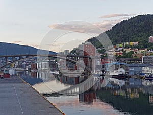 Looking through the arched road bridge and into Bergen City Centre at Dawn