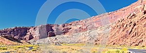 Looking back towards Moab Panorama views of desert mountain ranges along Highway 191 in Utah in fall. Scenic nature near Canyonlan