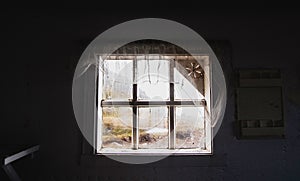 Looking through broken old window