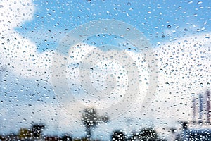 Looking through car windshield with rain drops. Background