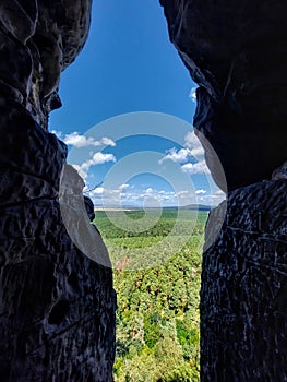 Looking through cave crack from the small mountain Regenstein in Germany