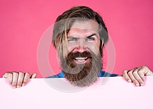 looking cheerful. confident and handsome. announcement and advertisement. happy smiling mature man. guy with beard hold