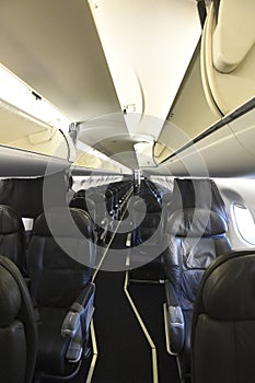 Looking down the aisle of an empty airplane interior