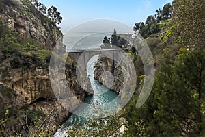 Looking down at the arched bridge and the fjord at Fiordo di Furore on the Amalfi Coast, Italy