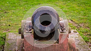 Looking down the barrel of a cannon on the Moat Brae at Kirkcudbright