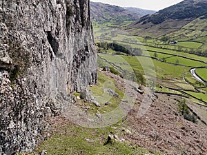 View down Great Langdale from rockface on hillside photo