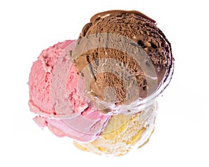 Looking down on an ice cream cone with edible chocolate, strawberry and vanilla ice cream isolated on white background