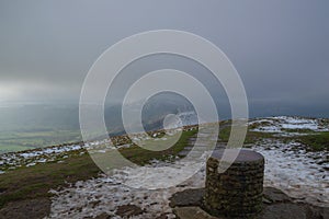 Looking down from Lose Hill, over the trig point at its peak, in the Hope Valley, Peak District, Derbyshire