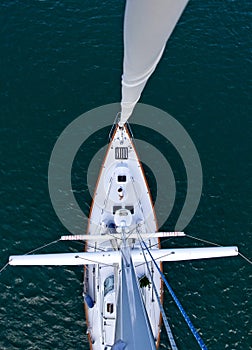 Looking down the mast of a tall modern sailboat