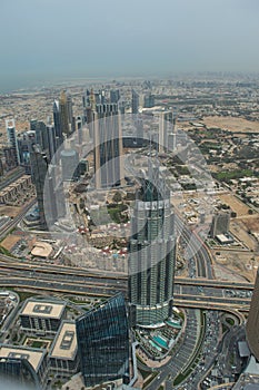 Looking down over the Dubai cityscape from the top of the Burj Khalifa in Dubai