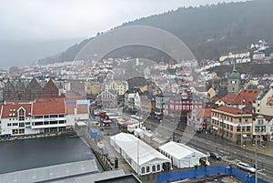 Bergen, Norway - 13th April 2011: Looking down over the Fish Market of Bergen City on a wet, misty day, with People shopping.