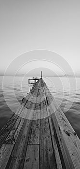 Looking down pier b&w