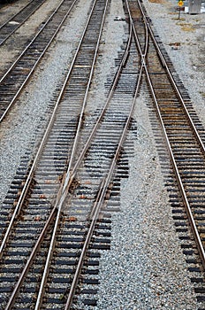 Looking down on the railroad tracks in a train yard.