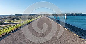 Looking down road on top of Canyon Lake dame - horizontal