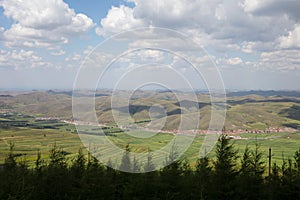 Looking down and shooting the grassland scenery of Zhangbei County under the blue sky and white clouds