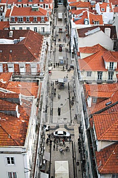 Looking down on the street and roofs of buildings in birds-eye-view.