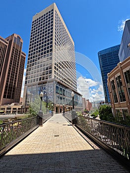 Looking Down a Walkway Toward a Large Business Building in a Downtown City