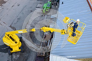 Looking down on woman in cherry picker