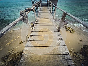 Looking down on wooden pier at beach