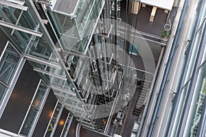 Looking downwards in a modern open elevator shaft