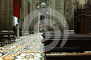 looking Duomo di Milano meaning Milan Cathedral in Italy, with blue sky