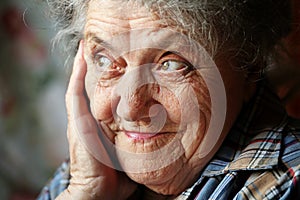 Looking elderly woman face close up