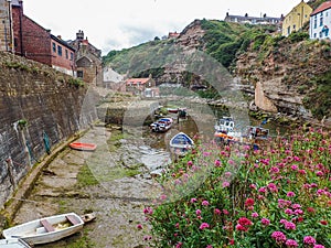 Looking at fishing boats and cottages in Staithes in North Yorkshire
