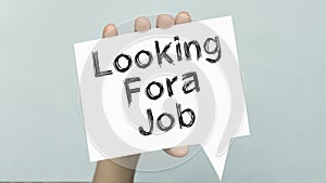 LOOKING FORA JOB text on a kard.