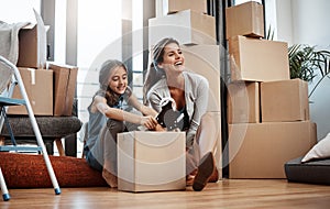 Looking forward to a fresh start. Full length shot of an attractive young woman and her daughter moving into a new house