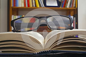 Looking glasses on an open book