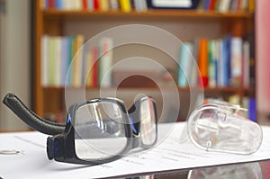 Looking glasses on an open book