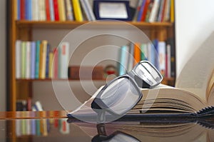 Looking glasses on an open book