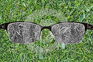 Looking through glasses to bleach grass. Color blindness. World perception during depression. Medical condition. Health and