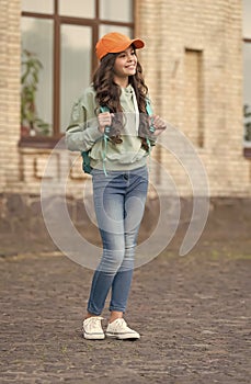Looking incredibly pretty. Happy girl in autumn style outdoors. Trendy autumn fashion. Stylish trends. Childrens wear