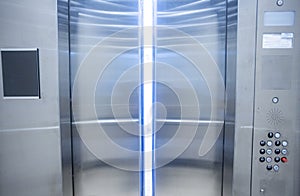 Looking from inside an elevator to the outside with the doors partially opened