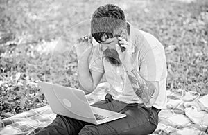 Looking for inspiration. Man bearded with laptop sit meadow nature background. Blogger becoming inspired by nature