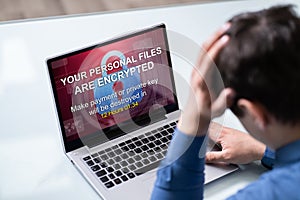 Looking At Laptop Screen Showing Personal Files Encrypted Text