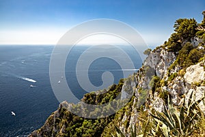 Looking at the Mediterranean Sea for a high vantage point with the summit of a rocky peak in the forground