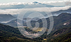 Looking at the Mexican Town of El Tuito from La Bufa in a Forested Landscape, Jalisco, Mexico photo