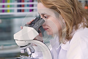 Looking through a microscope