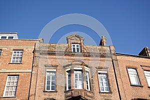 Looking up at an old brick building