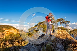 Looking out across the mountains from a rocky cliff