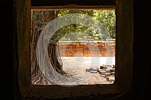 Looking out an ancient window at the Cambodian temple Ta Prom