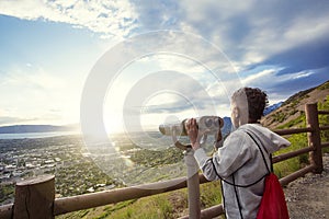 Looking out through binoculars at a beautiful mountain view