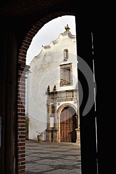 Looking out the door of the `new` church at the old church in Tapalpa, Jalisco, Mexico photo