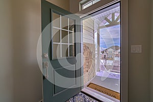 Looking out of an open front door of a house