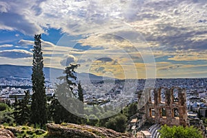 Looking out over the cityscape of Athens and over the Odeon of Herodes Atticus from the Acropolis near sunset