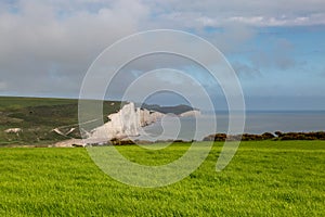 Looking out over a field towards the Seven Sisters cliffs on the Sussex coast